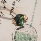 Oval Turquoise Cabochon (10kt) Ring with fleur-de-lis shoulders