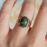 Oval Turquoise Cabochon (10kt) Ring with fleur-de-lis shoulders