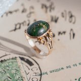 Oval Turquoise Cabochon (10kt) Ring with fleur-de-lis shoulders
