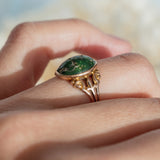 Oval Turquoise Cabochon (10kt) Ring with fleur-de-lis shoulders